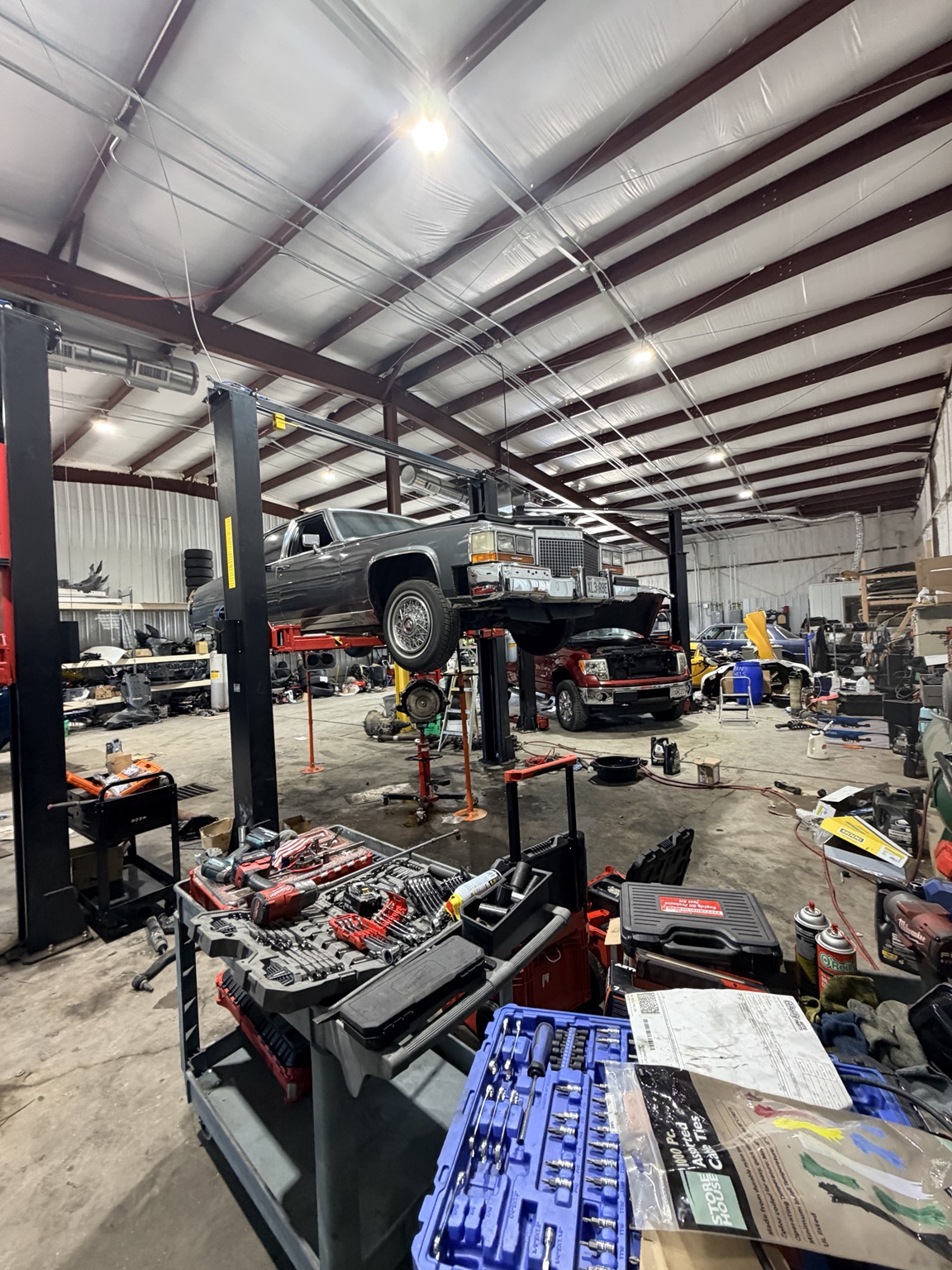 1988 cadillac on a shop lift.